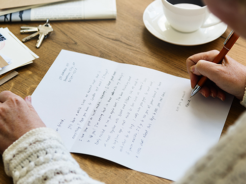 Handwriting a letter to a neighbor>